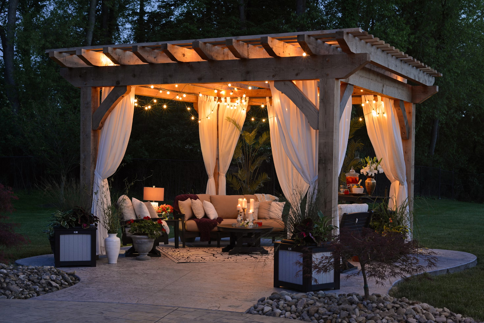 patio in backyard with pergola, dangling lights, and outdoor furniture